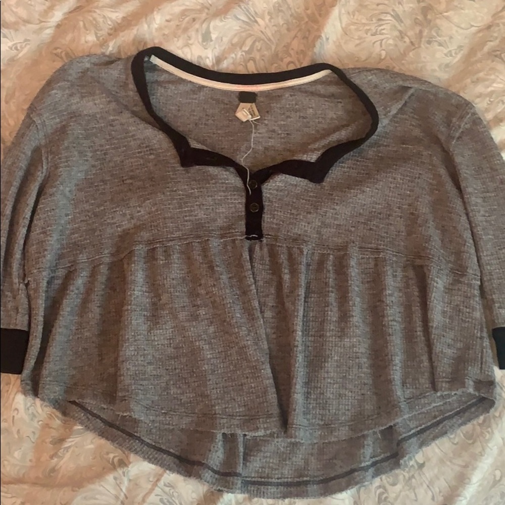 Gray top with black trim and buttons